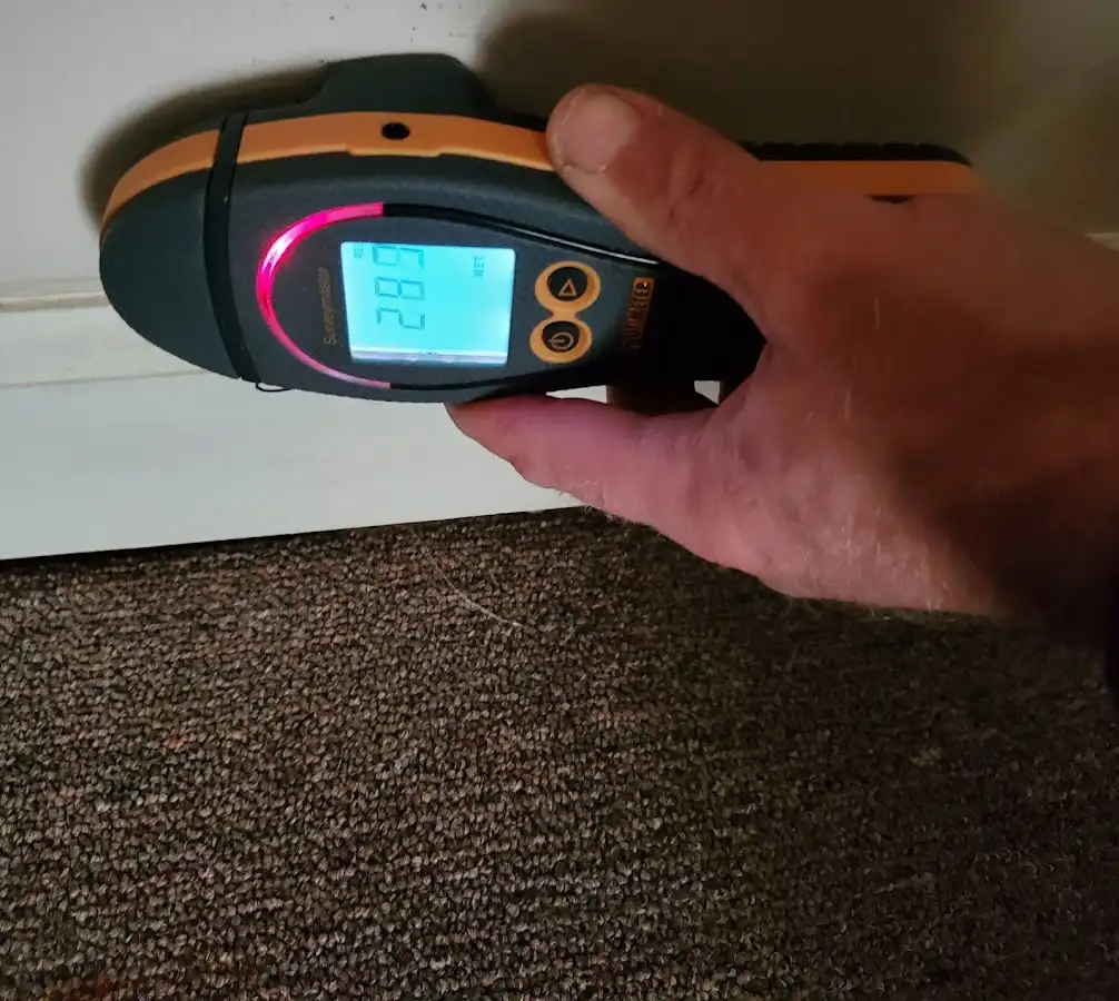 Moisture detection at baseboard during Storm Damage Restoration in Washingtonville